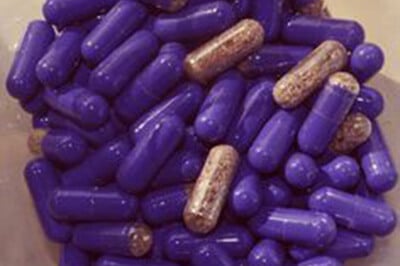 Placenta Encapsulation purple and gold flavor capsules.